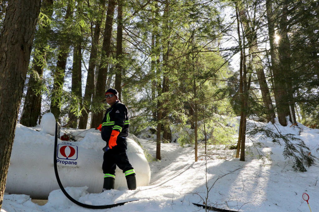 Kelly's Propane driver making a Winter Delivery